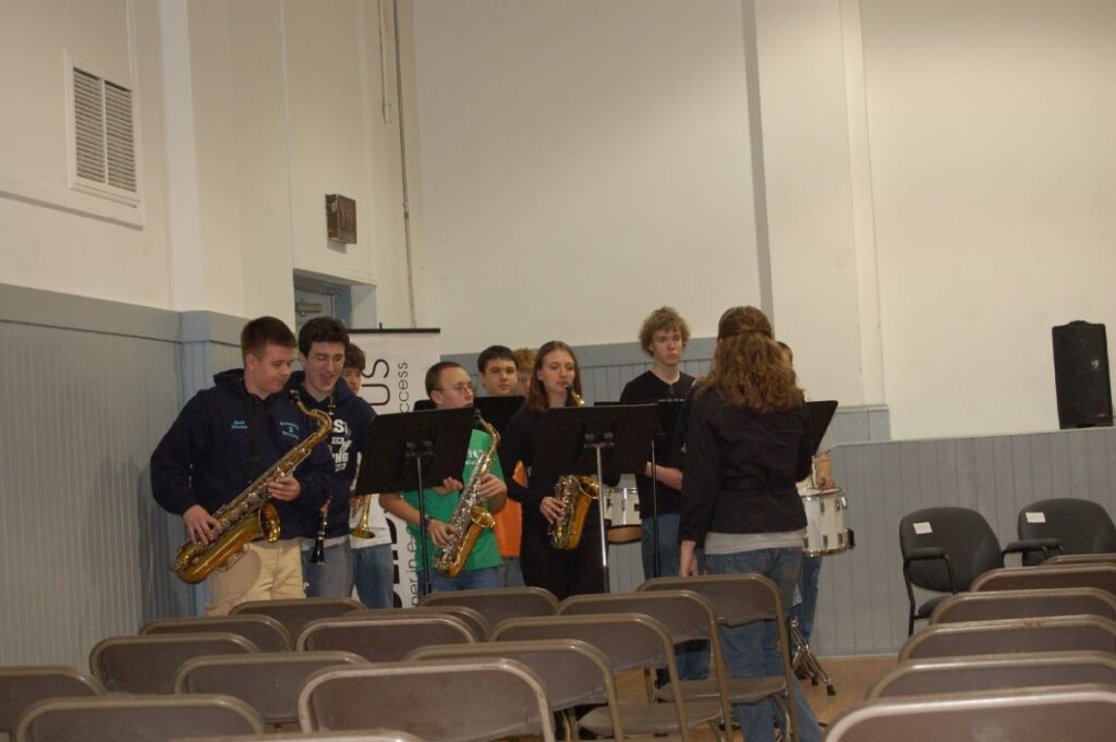 The Dallas High School Band plays as guests arrive for the ribbon cutting.