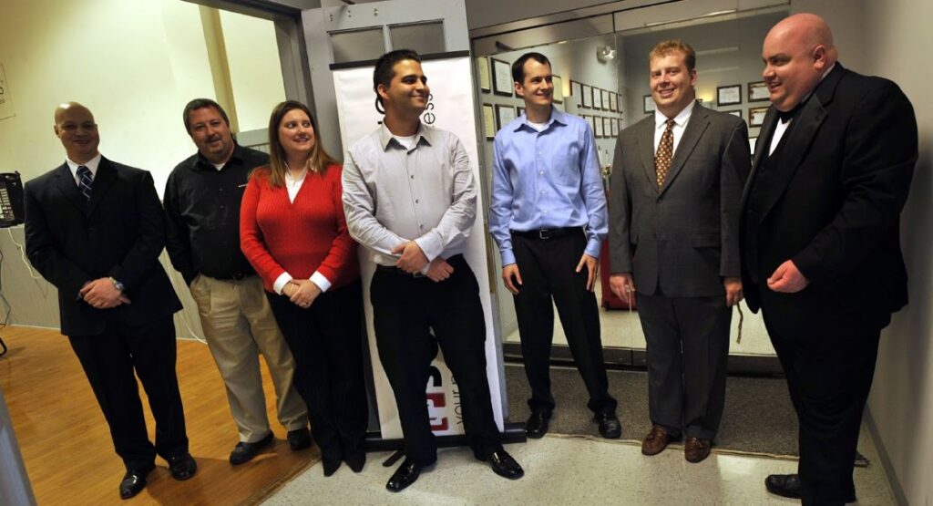 Members of the executive team including co-founder Joe Palko welcome guests to the ribbon cutting.