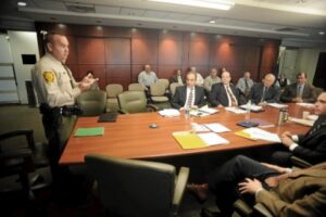 Pennsylvania Game Commission Wildlife Conservation Officer Phillip White, left, briefs the Wilkes-Barre/Scranton International Airport Authority Board during meeting on Thursday about the shooting of four bears that were inside the perimeter fence at the airport. Photo credit: Mark Moran, Citizens' Voice