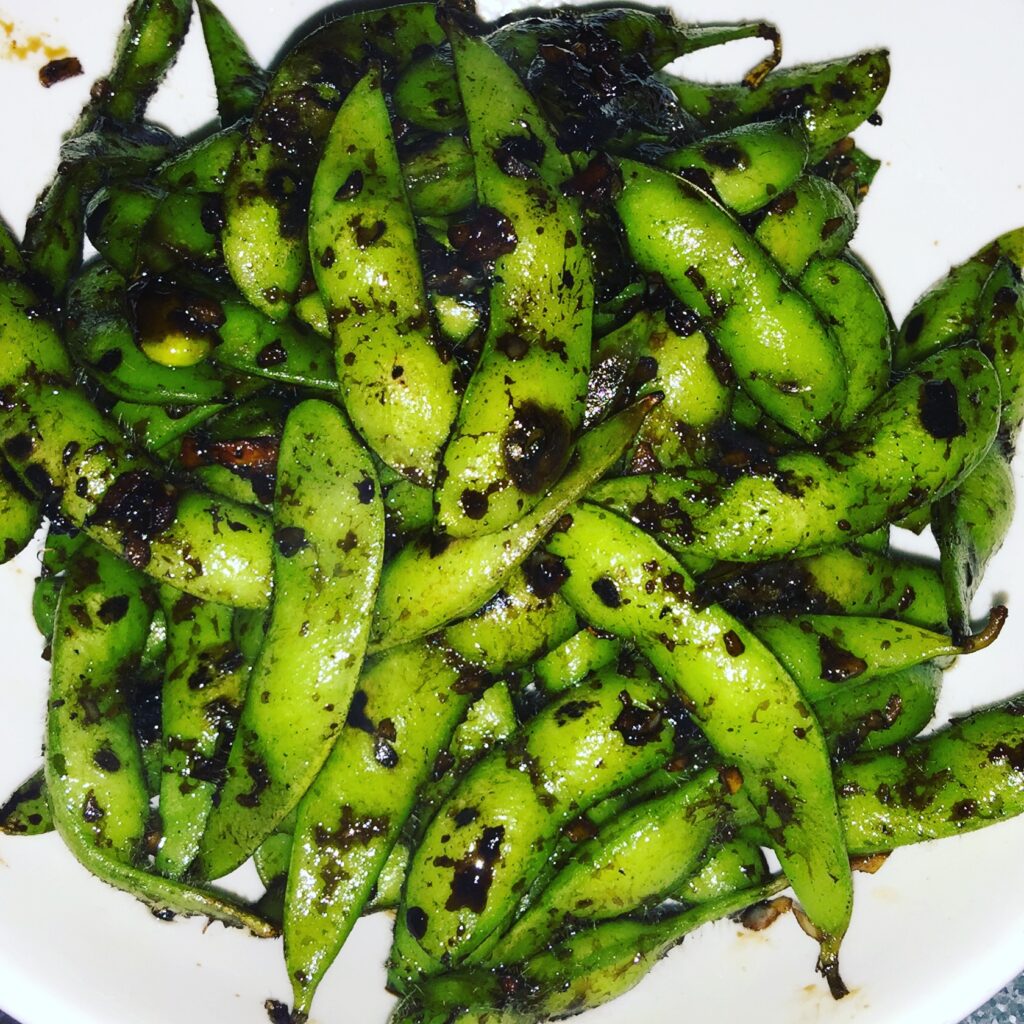 Wok-charred edamame with toasted sesame oil, garlic and soy from Kapow Noodle Bar in Boca Raton