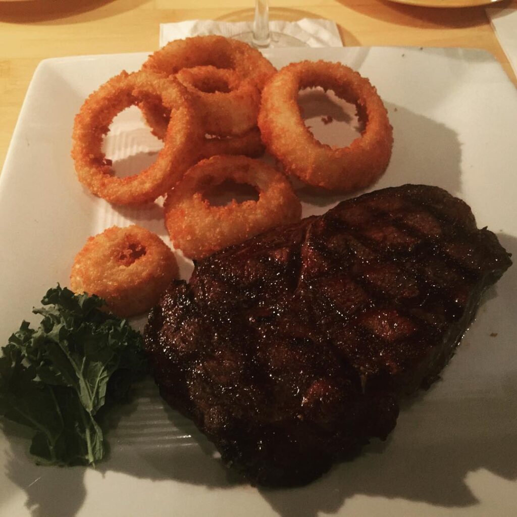 Ribeye steak with onion rings from Bimini Twist in West Palm Beach