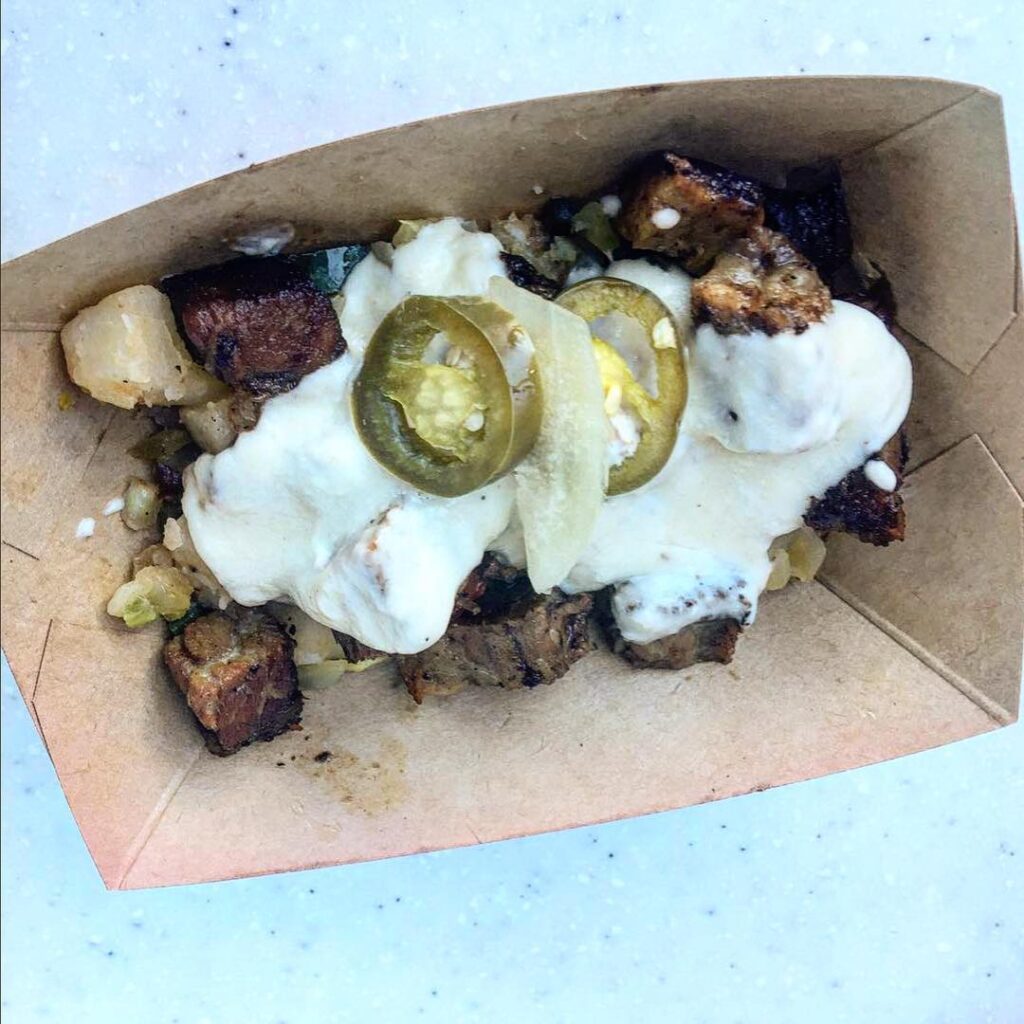 Beef Brisket Burnt Ends Hash with White Cheddar Fondue and Pickled Jalapeños from the International Flower & Garden Festival at Epcot