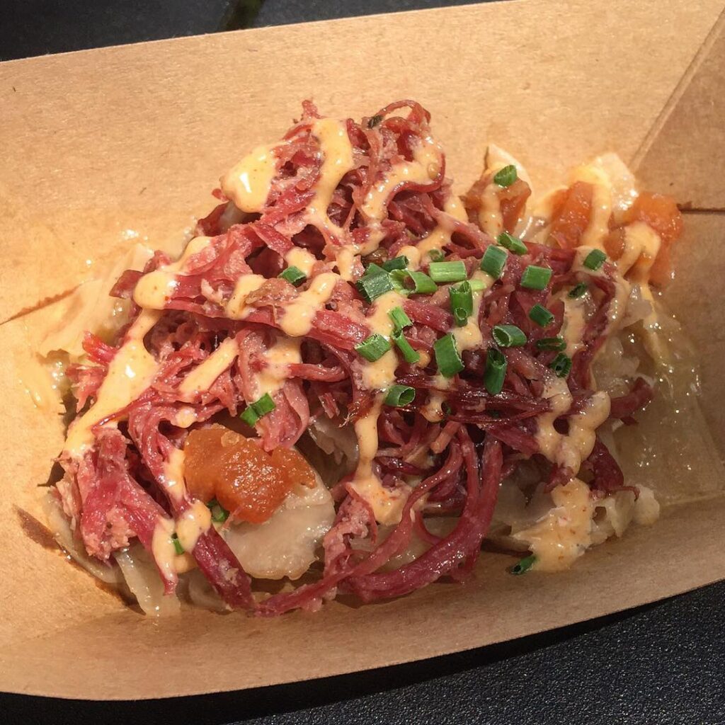 Pear Cider-brined Shredded Corned Beef with Braised Cabbage and Branston Dressing with Pears from the International Flower & Garden Festival at Epcot
