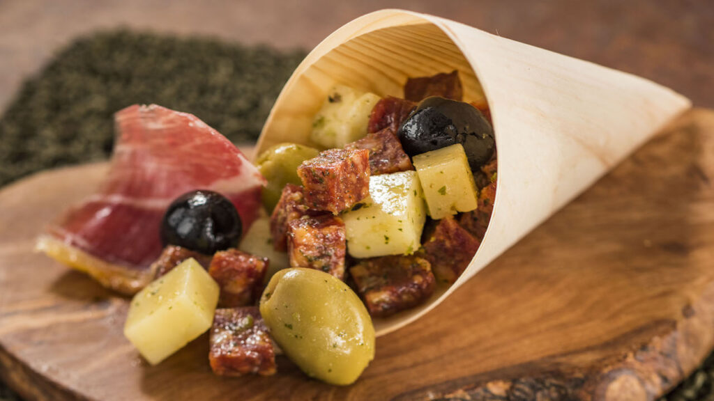 Charcuterie in a Cone with a selection of imported Spanish Meats, Cheeses, and Olives with an Herb Vinaigrette from the Epcot International Food & Wine Festival