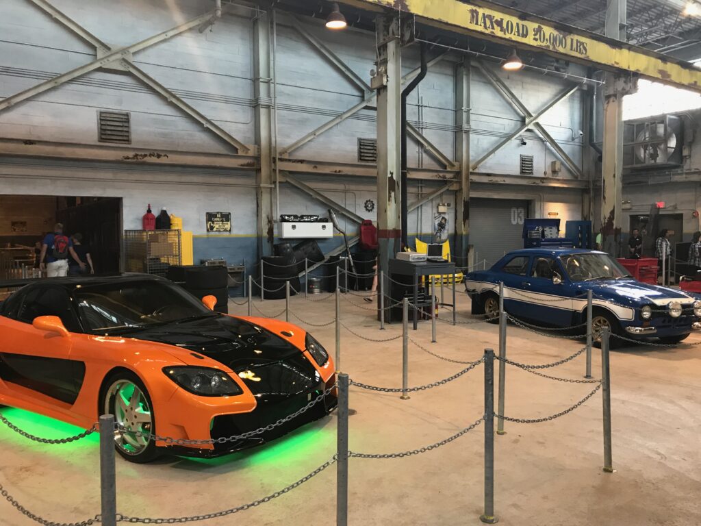 A few authentic vehicles in the queue of the Fast & Furious Supercharged ride at Universal Studios Orlando
