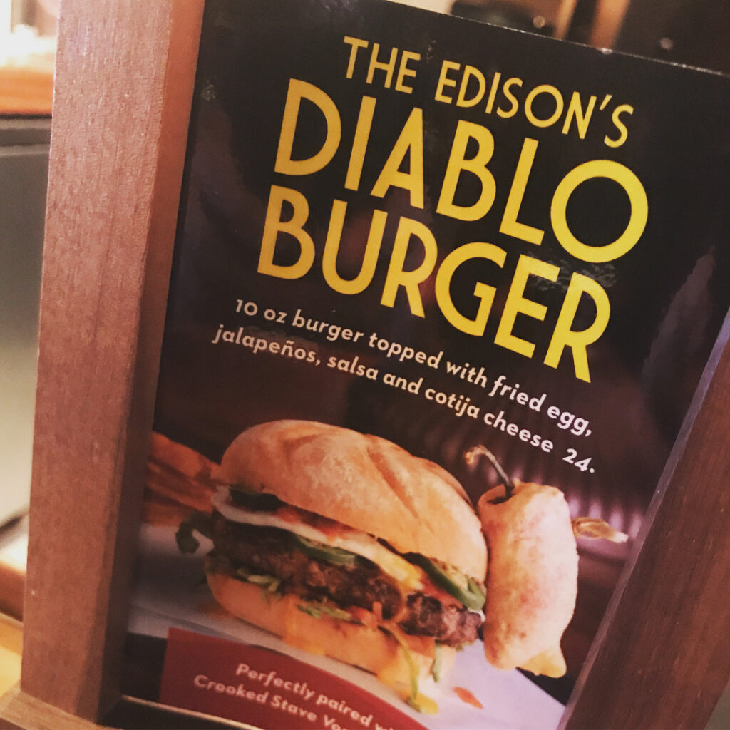 Table tent advertisement for The Diablo Burger from The Edison in Orlando