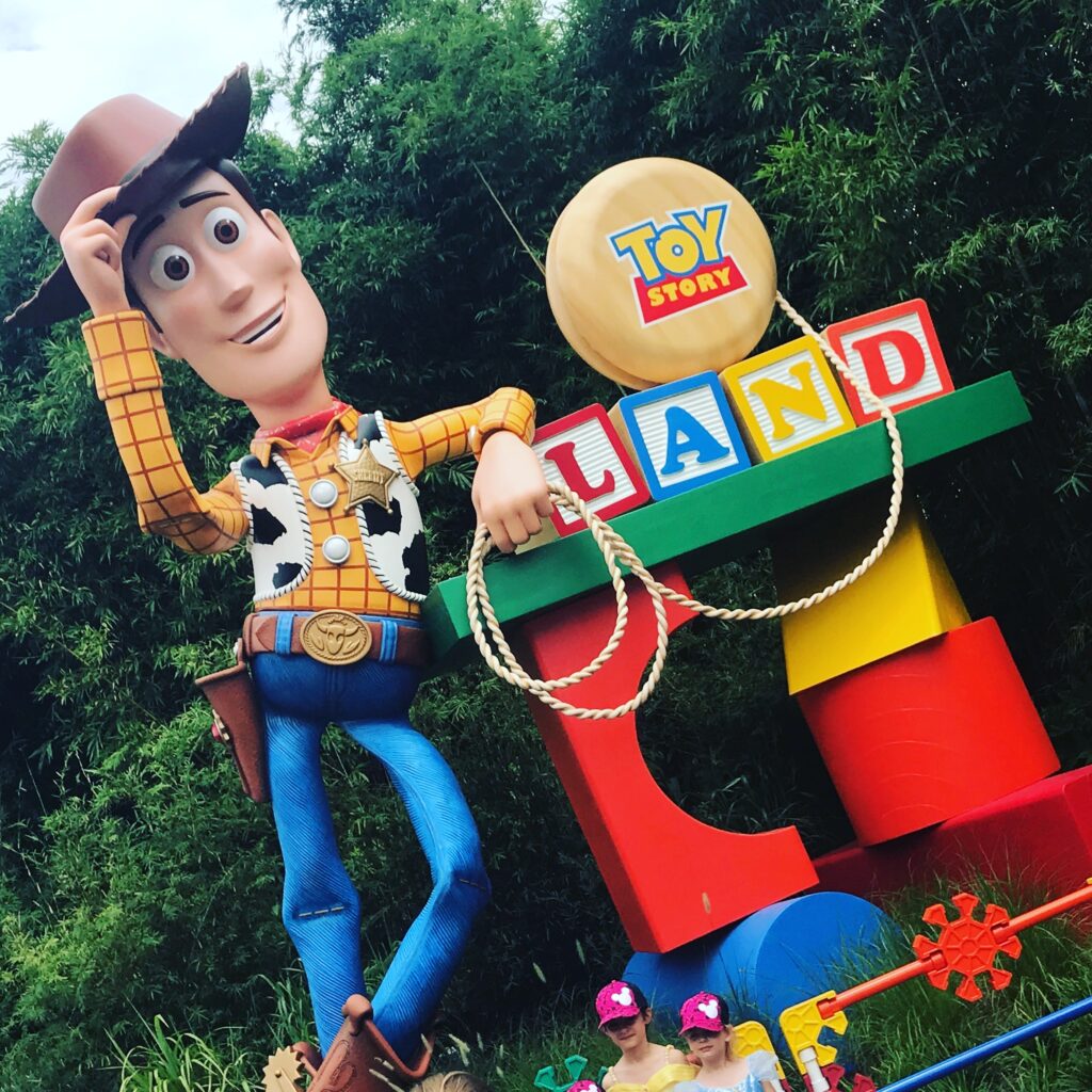 Woody greets visitors at the entrance of Toy Story Land at Disney's Hollywood Studios