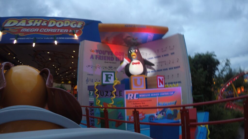 Weezy, from the Toy Story movie, serenades riders at the end of the ride on Slinky Dog Dash