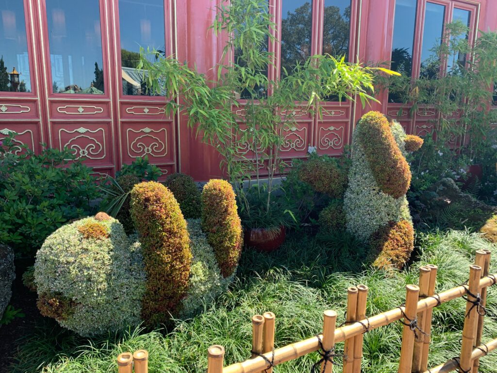 The giant panda has a few playful friends joining him in the China garden