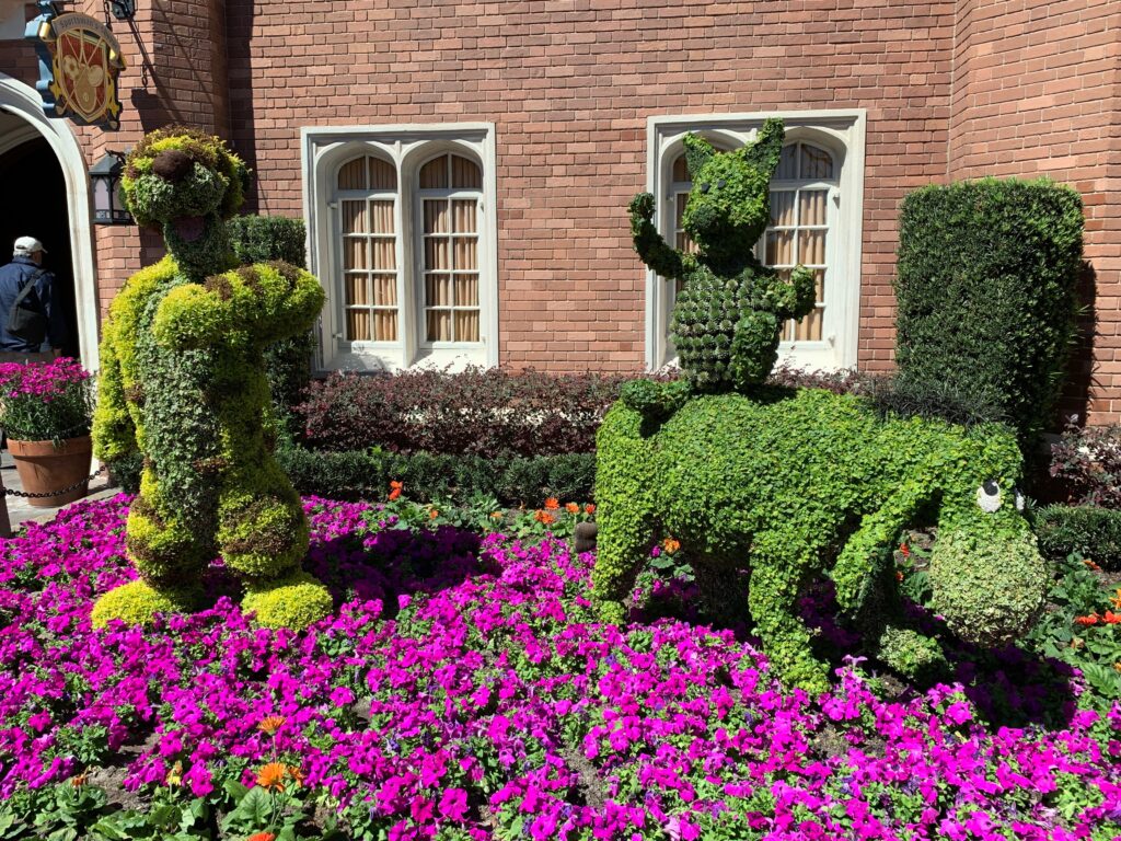 All the Winnie the Pooh characters are out in the garden in the UK Pavilion